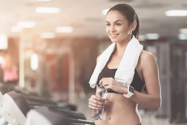 Overjoyed woman wearing a towel after workout — Stock Photo, Image