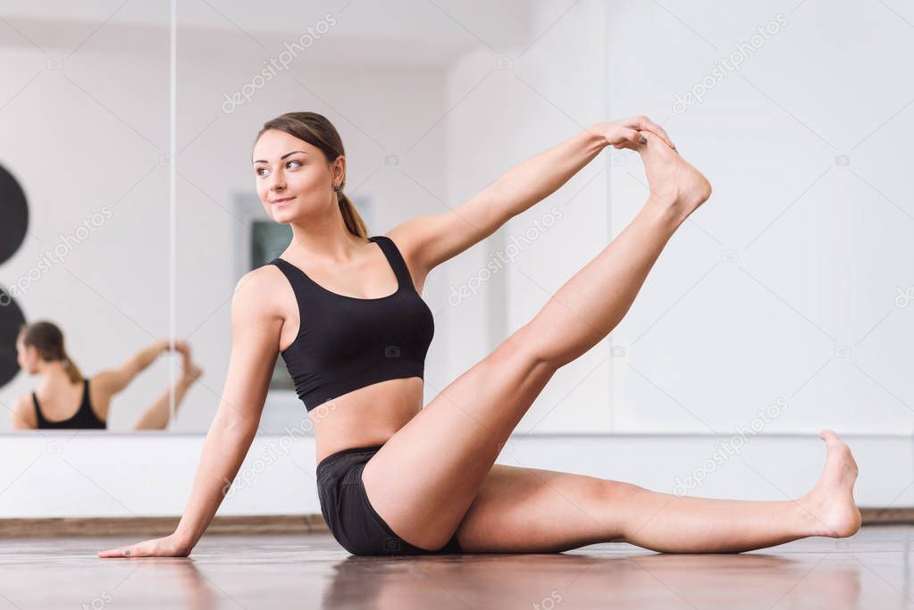 Pleasant masterful dancer doing an exercise