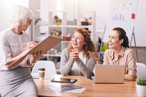 Positive businesswomen working in the business center