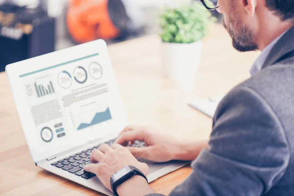 Pleasant concentated man using laptop — Stock Photo, Image