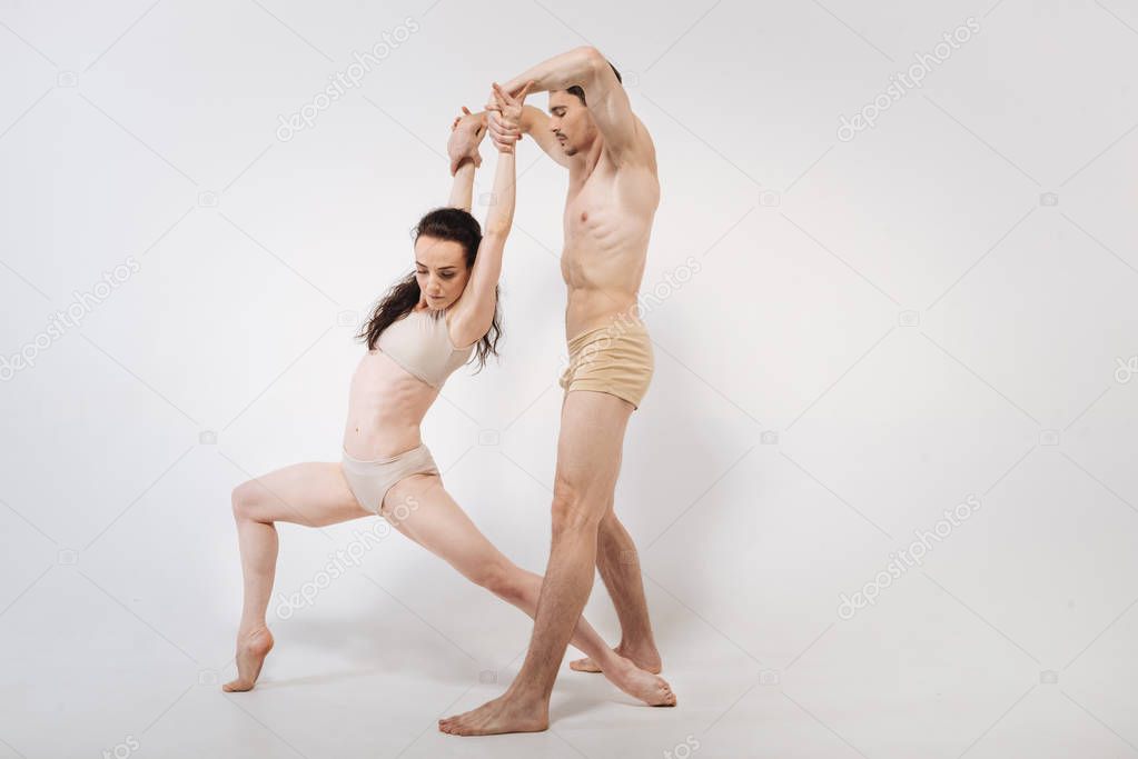 Artistic young gymnasts stretching