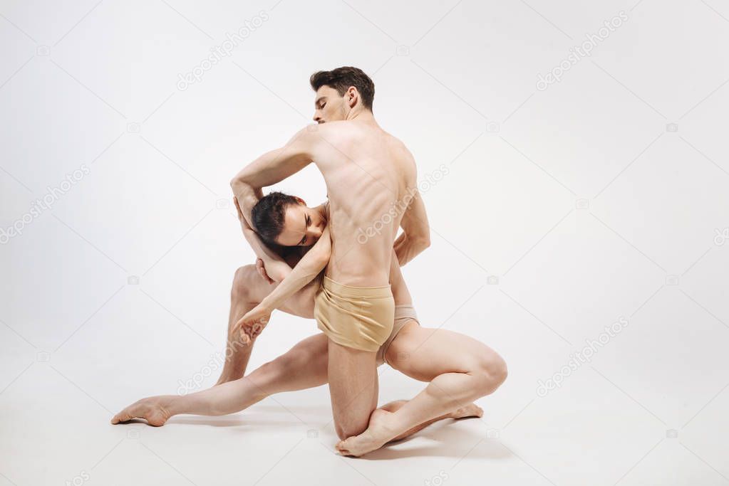 Flexible slim ballet dancers performing 