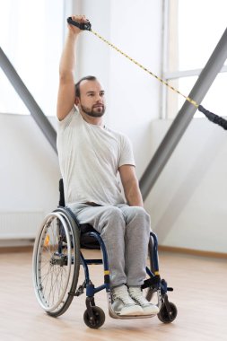 Confident young disabled working out in the gym