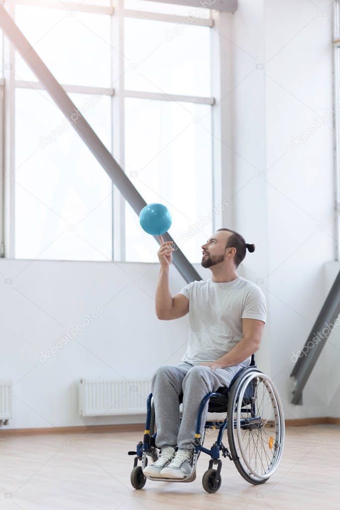 Involved young handicapped holding the ball in the gym