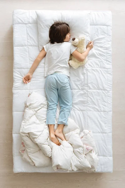 Tired young boy having a nap — Stock Photo, Image