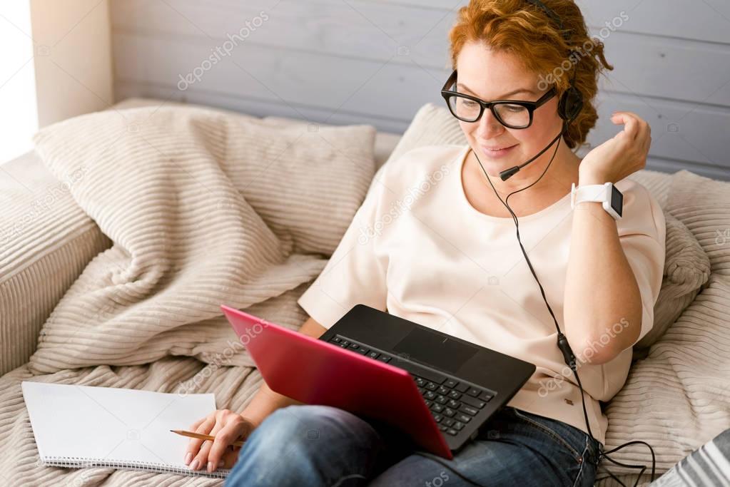 charming woman working at home