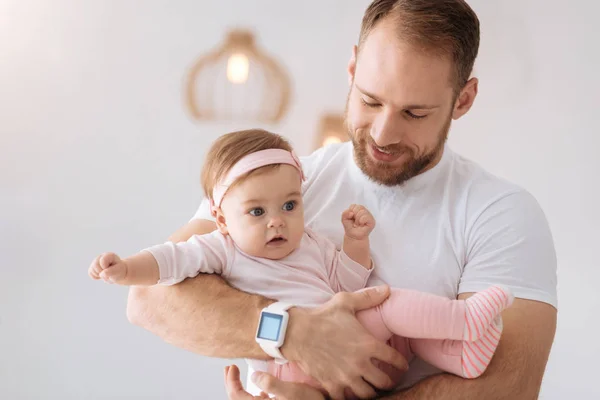 stock image Careful young father holding his newborn at home