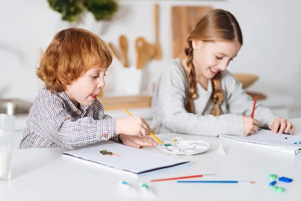 Talented bright siblings creating masterpieces — Stock Photo, Image