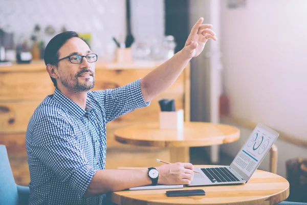 Pleasant man sitting in the cafe — Stock Photo, Image