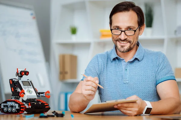 Positive engineer working in a lab — Stock Photo, Image