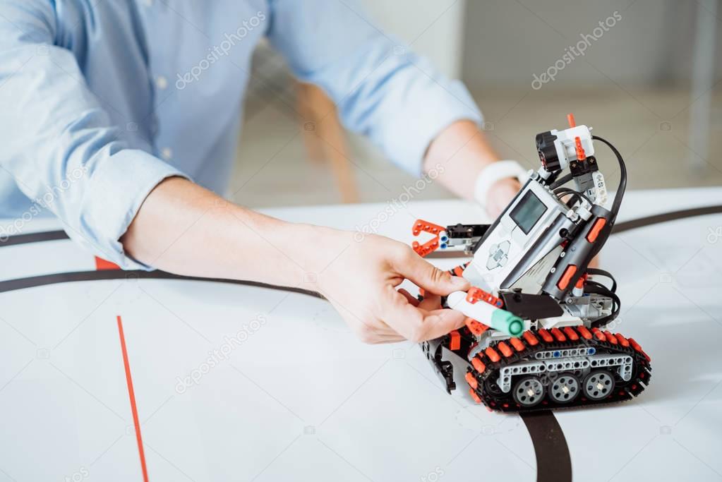 Professional engineer improving robot