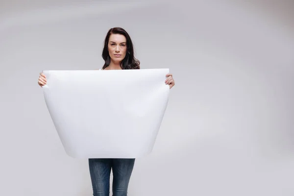 Woman  holding a blank poster — Stock Photo, Image