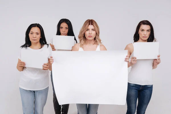 ladies demonstrating a big blank poster
