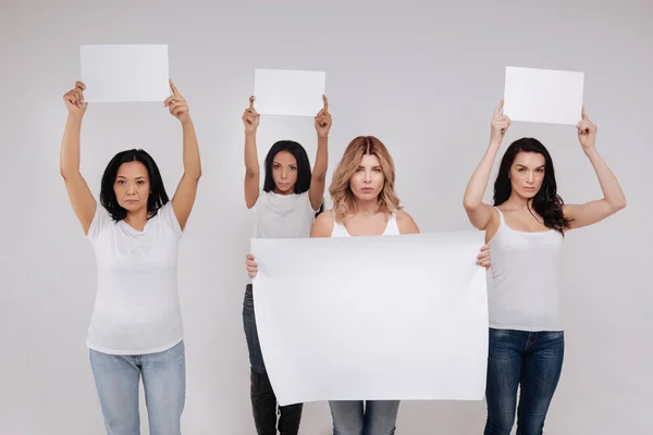 ladies demonstrating a big blank poster