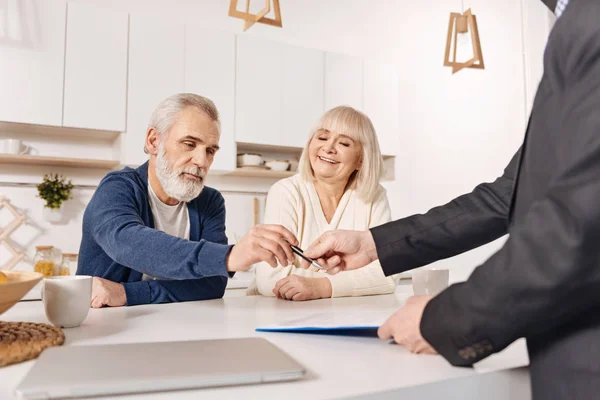 couple signing loan contract