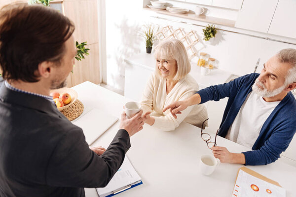 notary having meeting with aged couple 