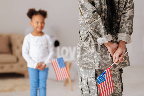 child greeting mom upon her arrival