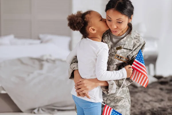 Girl kissing her beloved mother — Stock Photo, Image