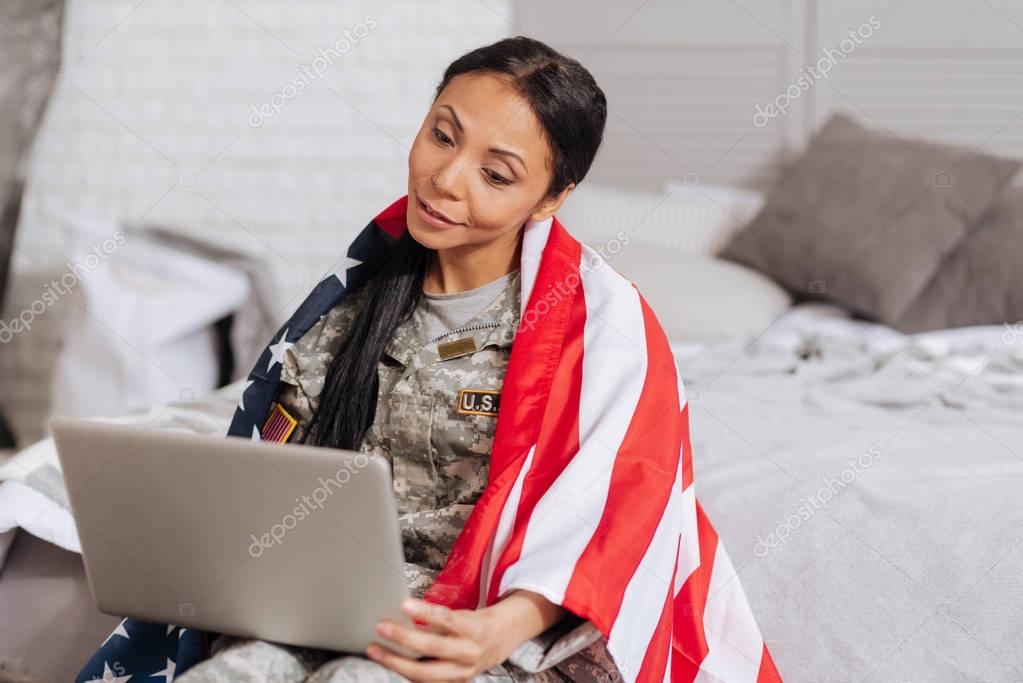 See you soon. Sweet loving tender lady calling her family while having some free time during her trip abroad