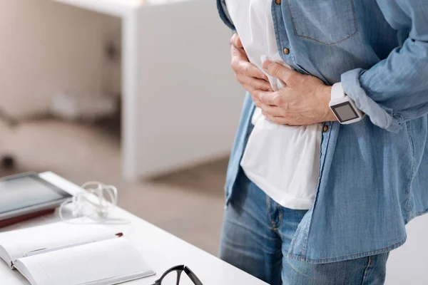 Photo of male having pain in belly — Stock Photo, Image