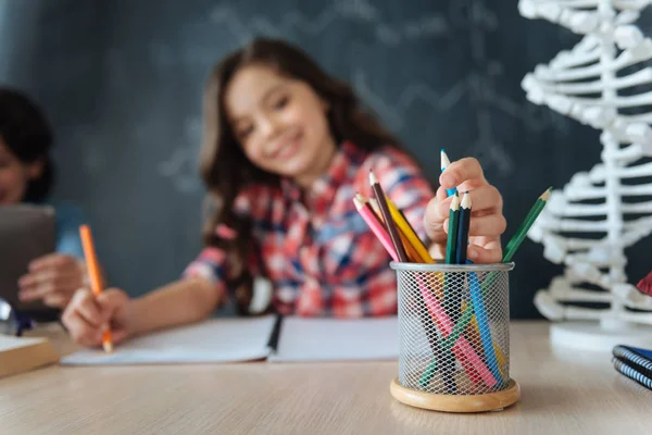 Girl enjoying art lesson at school — Stock Photo, Image