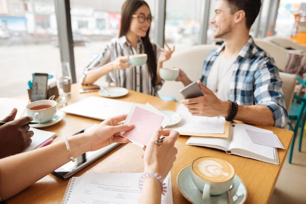 Cheerful students resting during coffee break at cafe — Stock Photo, Image