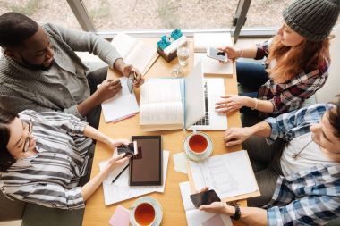 Top view of students studying together clipart