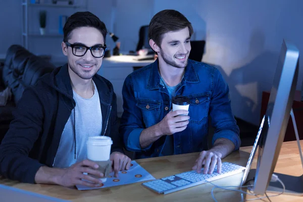 Cheerful genius hackers celebrating their success — Stock Photo, Image