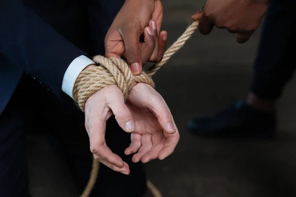 Nice unhappy man having his hands tied — Stock Photo, Image