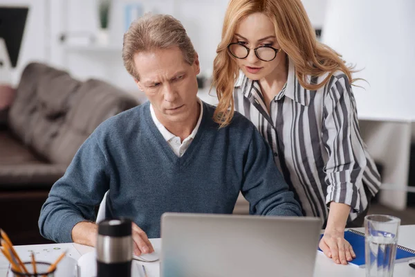 Sexy businesswoman seducing mature colleague in the office — Stock Photo, Image