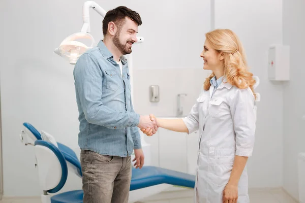 Delighted happy guy saying thanks to his dentist — Stock Photo, Image