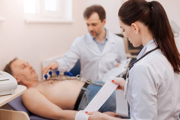 Excellent team diagnosing a heart disease