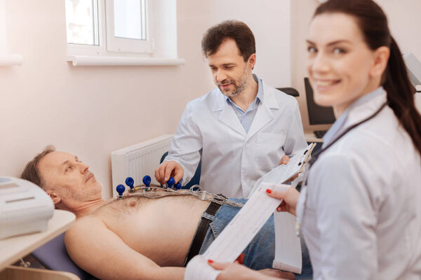 Trained medical professionals monitoring the procedure