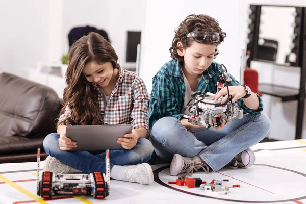 Cheerful kids using modern gadgets and devices at home — Stock Photo, Image