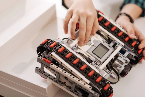 Clever child programming electronic robot in the studio — Stock Photo, Image