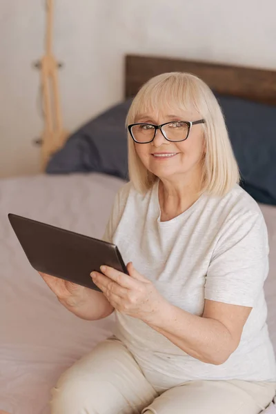 Nice good looking woman holding a tablet