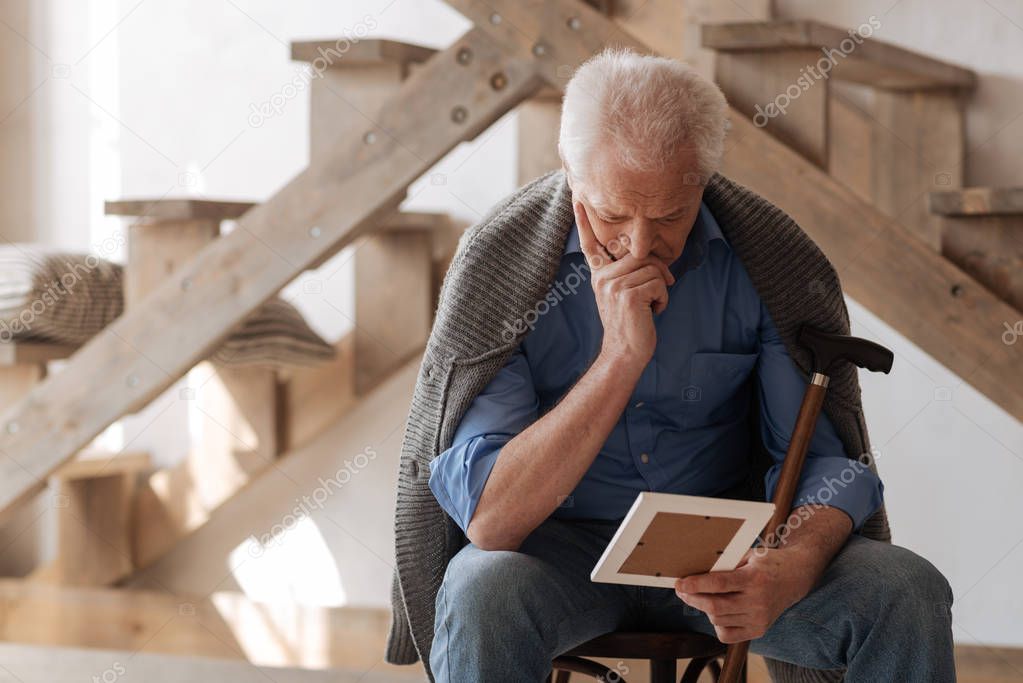 Thoughtful nice man missing his wife