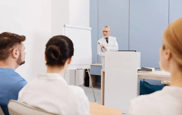 Qualified professor giving a lecture in the medical college