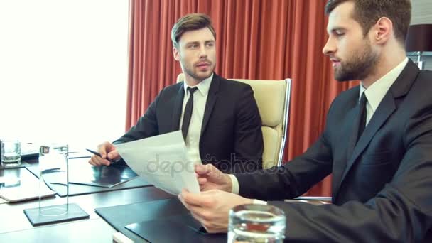 Professional men sitting in the office — Stock Video