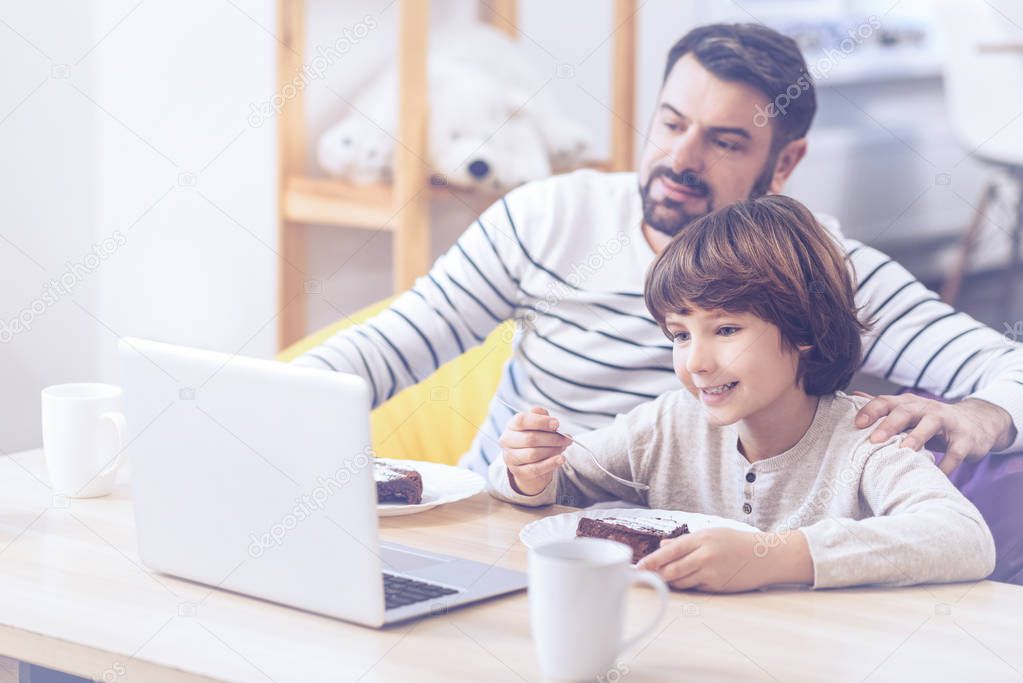 son and father spending time in family