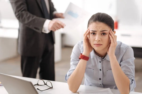 Upset young woman wrinkling her forehead — Stock Photo, Image
