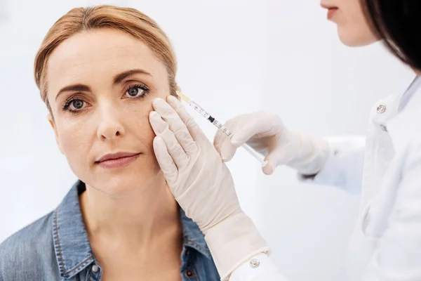 Pleasant blonde woman having a botox injection — Stock Photo, Image