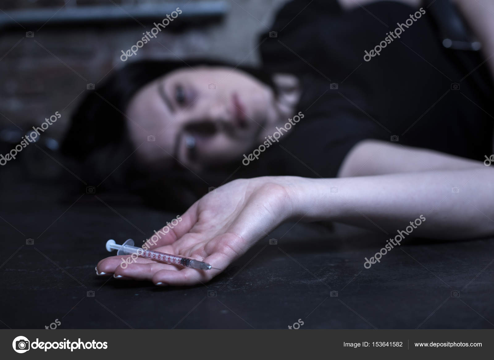 Exhausted drug addict lying on the ground Stock Photo by ©Dmyrto_Z ...
