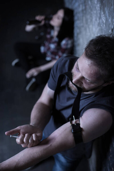 junkies using drugs in the dark place