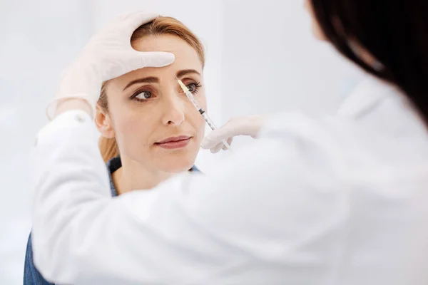 Woman visiting a cosmetologist — Stock Photo, Image