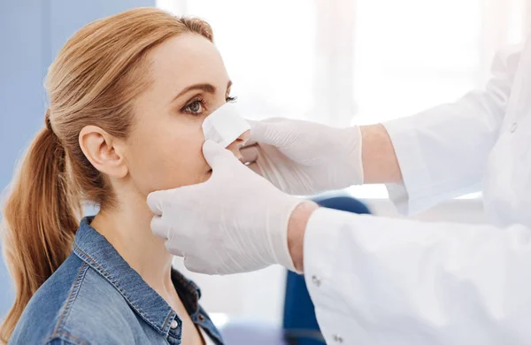 Doctor putting a medical dressing Stock Photo