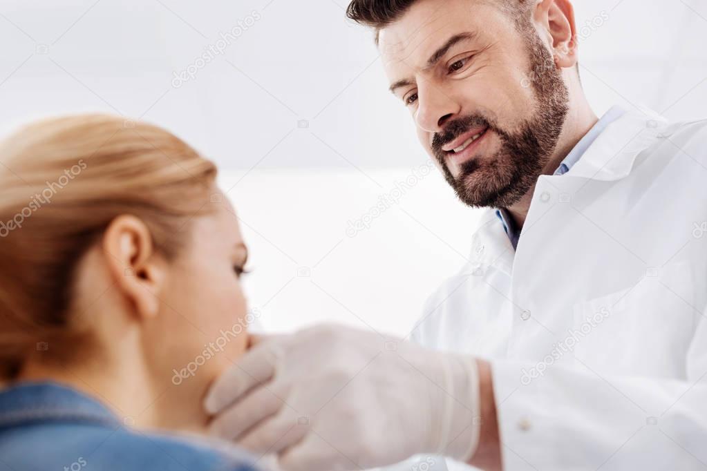 doctor looking at his patient