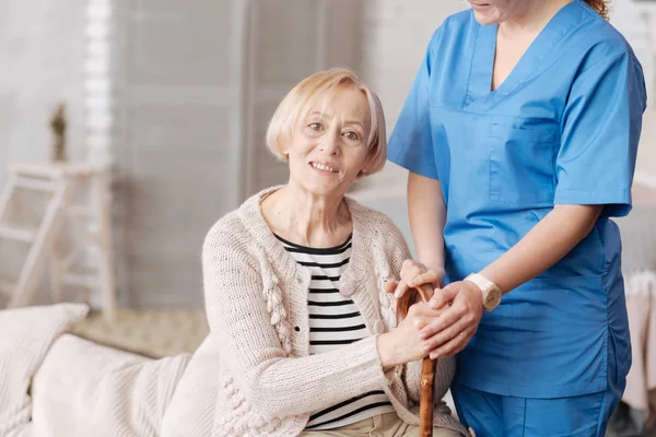 Private doctor taking care of elderly patient — Stock Photo, Image