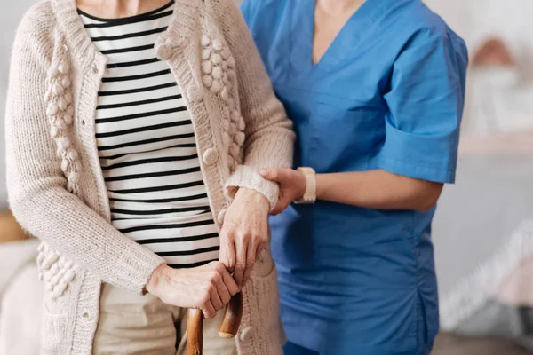 Dedicated private doctor supporting elderly patient — Stock Photo, Image