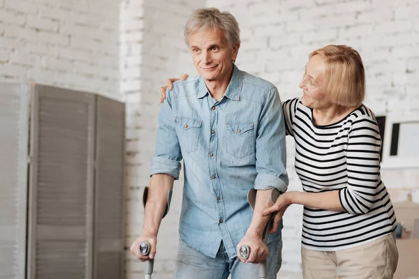 Lively charming senior couple going through recovery together